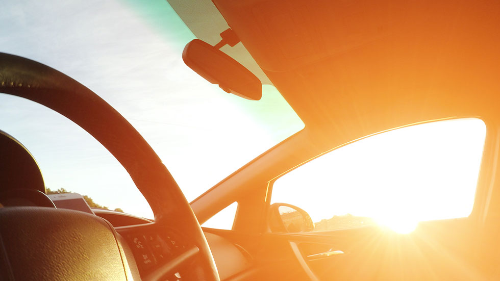 sun shining on car dashboard